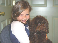              "Cooper", a
Chocolate-coloured Cockapoo
