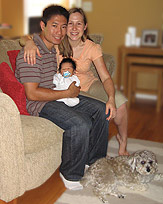   Peanut the Schnoodle with
his "parents" and new baby brother